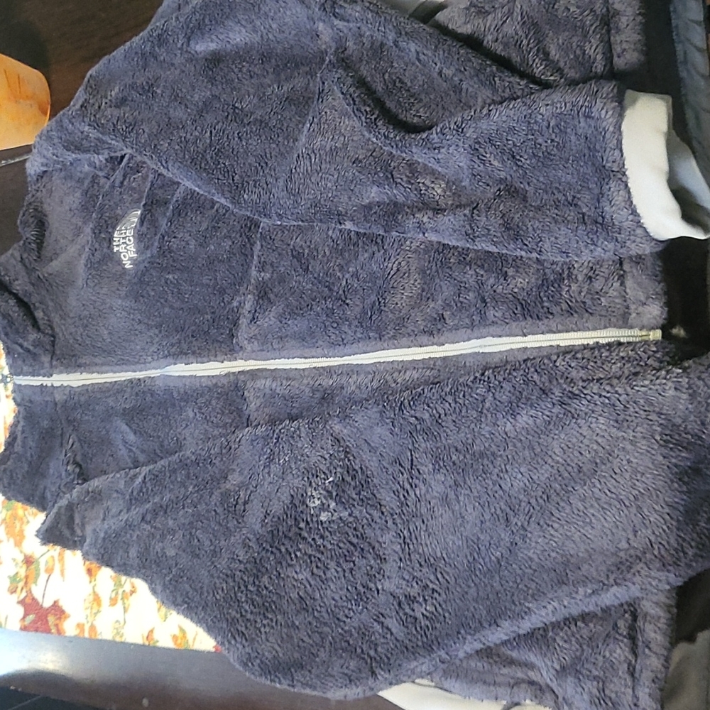 Woman's zip up coat.